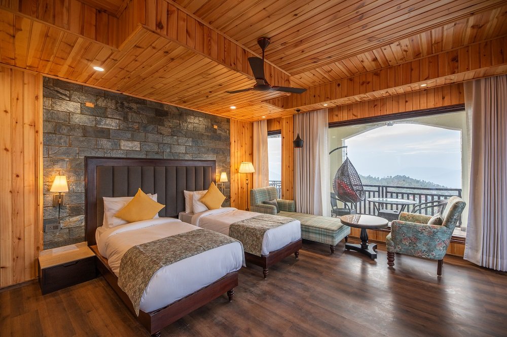 Buransh Retreat room at Ojaswi Himalayan Resort Mukteshwar with warm wooden interiors and mountain views