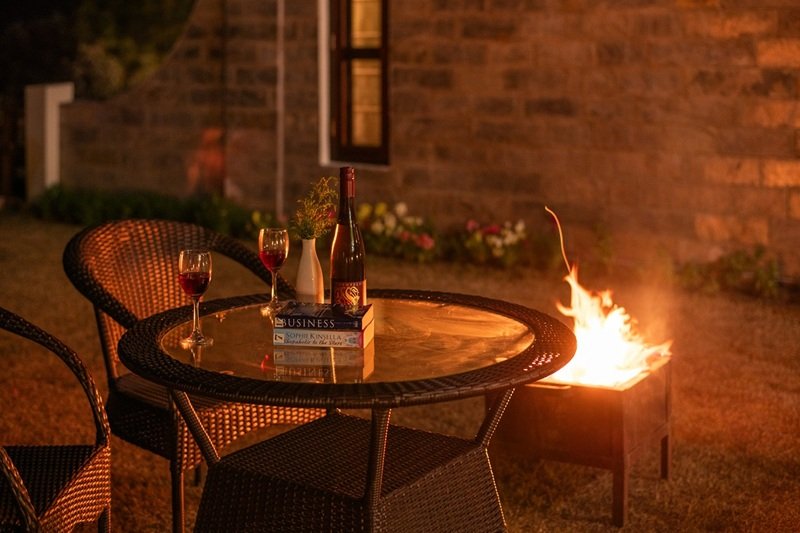 A scenic table for two with a direct view of the snow-capped mountains at Ojaswi Himalayan Resort’s premium restaurant.