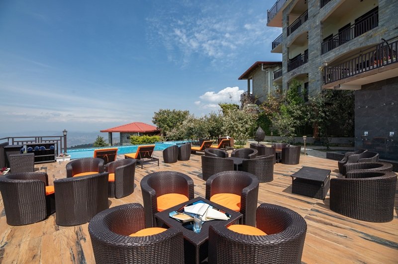 Authentic Kumaoni cuisine and local Pahadi flavors prepared by expert chefs at Ojaswi Himalayan Resort.