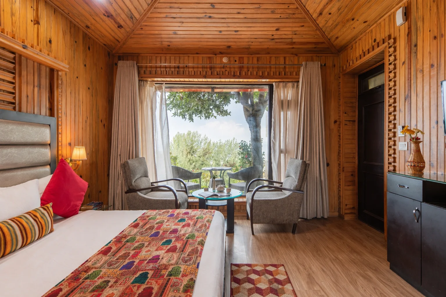 Jungle Retreat at Ojaswi Resort Mukteshwar - Luxury rustic cottage with British-inspired architecture and mountain views.
