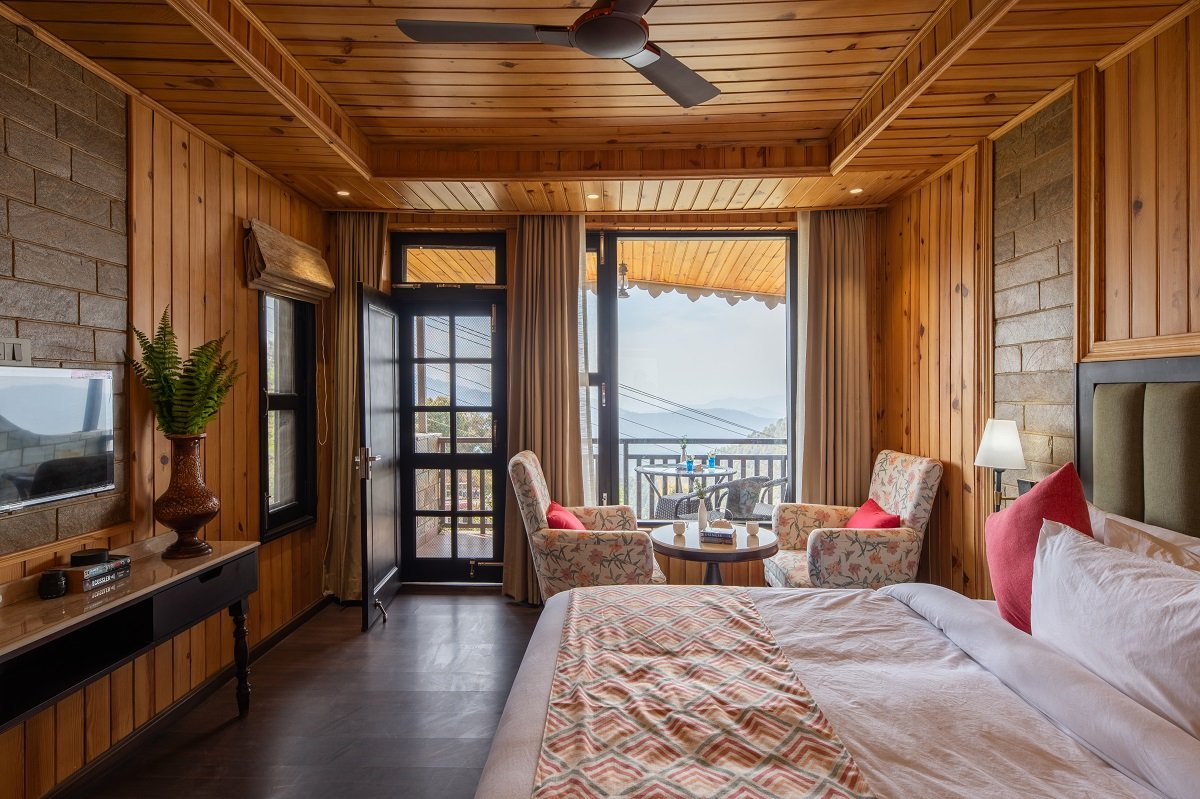 Private balcony with sunset valley view at Ojaswi Himalayan Resort Mukteshwar.