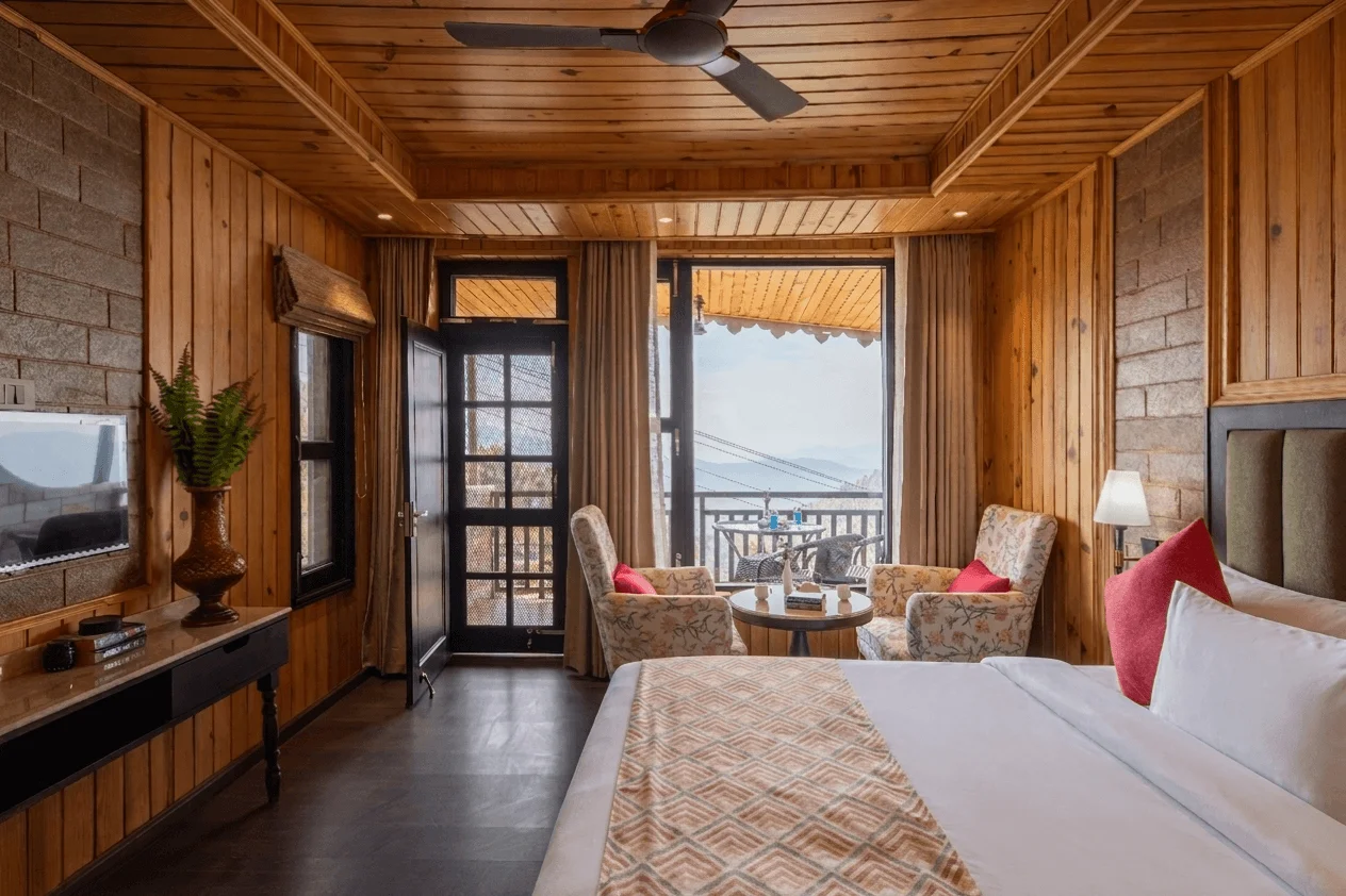 Private balcony with sunset valley view at Ojaswi Himalayan Resort Mukteshwar.