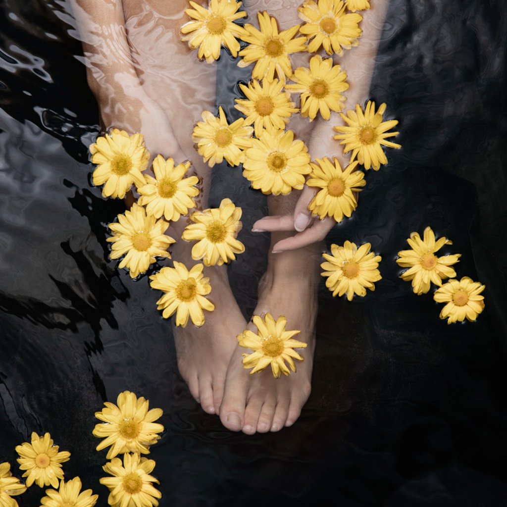 Guests enjoying a Sunset Hi-Tea on a deck with a stunning mountain view at Ojaswi Resort.