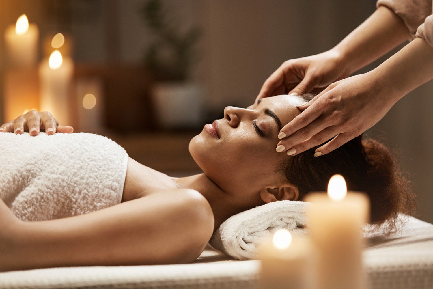 A guest relaxing at the edge of the infinity pool at Ojaswi Resort, taking in the expansive mountain landscape.
