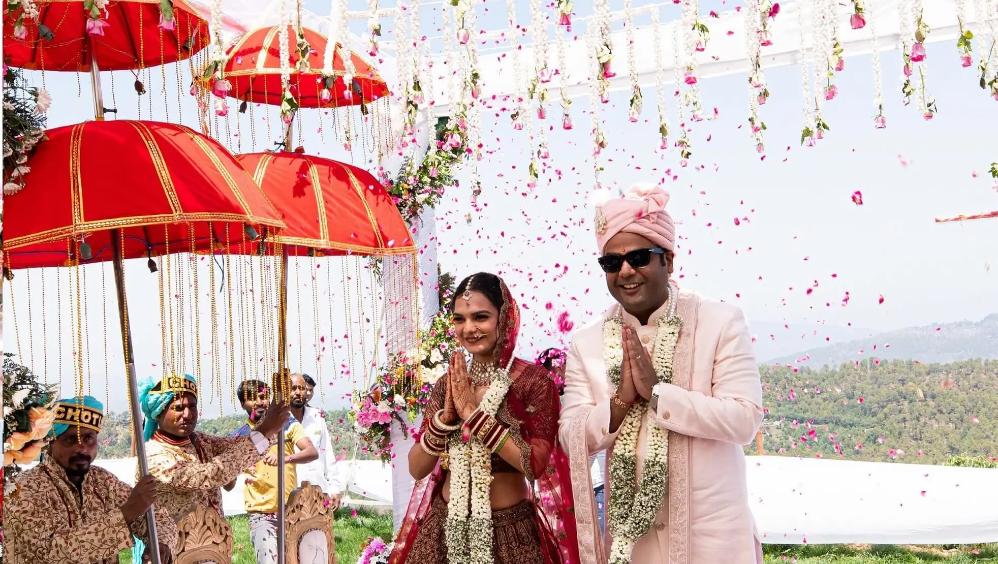 Couple posing for post-Jaimala wedding photographs at Ojaswi Resort, Uttarakhand