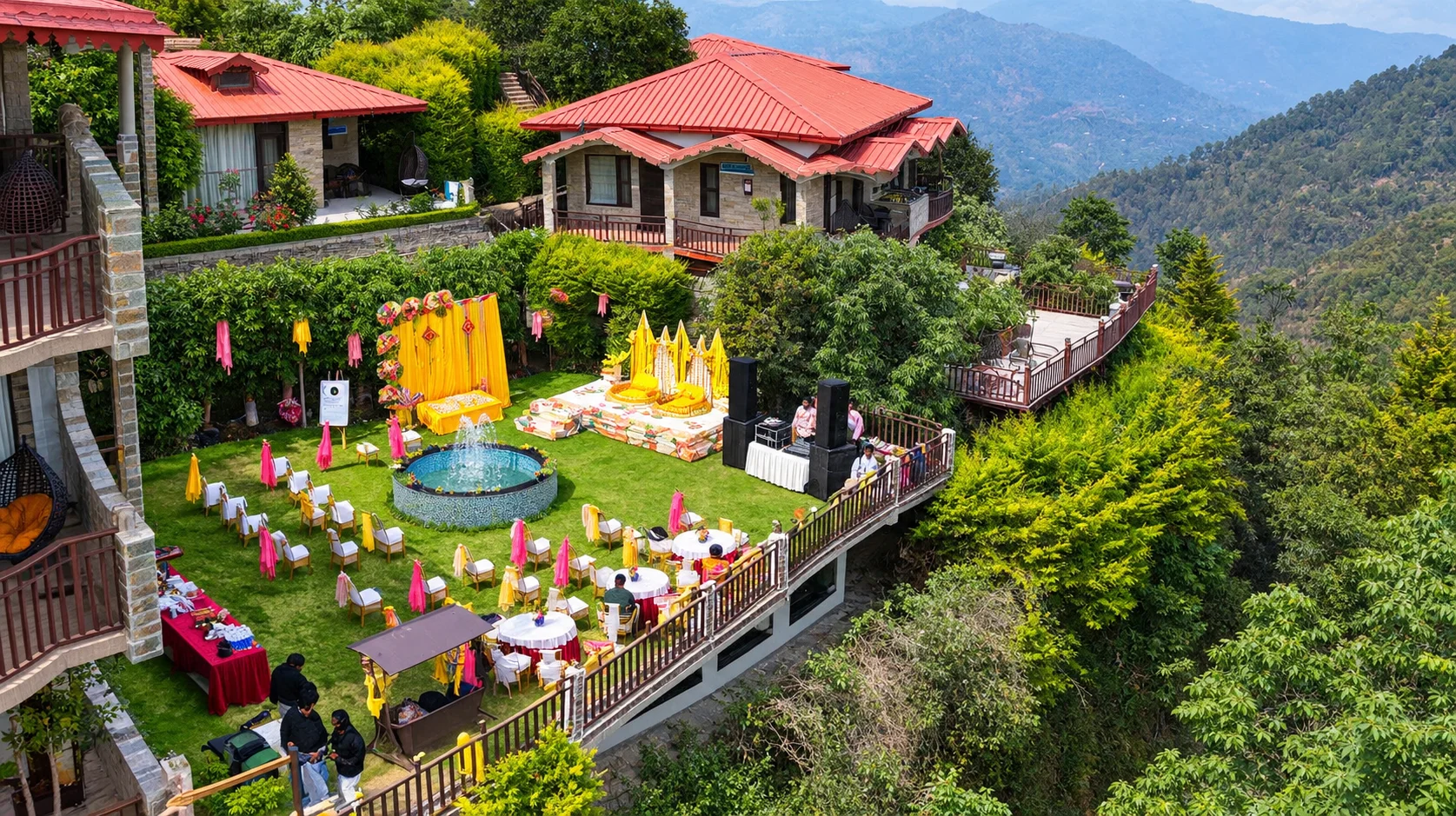 Mountain resort lawn with outdoor event setup.