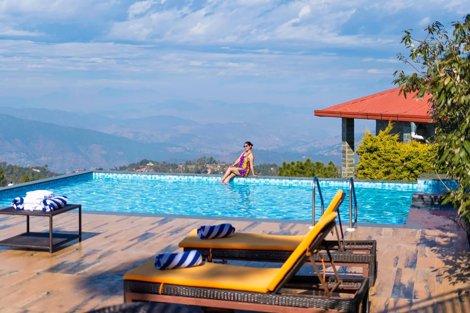 Heated infinity pool with mountain views at Ojaswi Resort