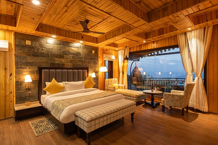 Couple enjoying Himalayan views at Ojaswi Resort Mukteshwar Uttarakhand